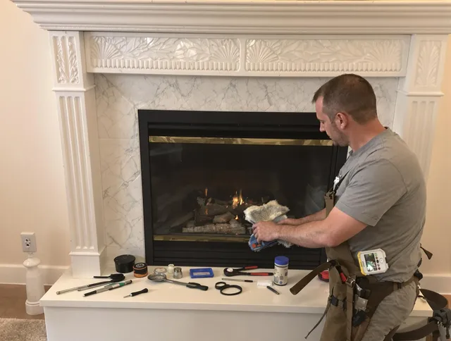 Hull Chimney Sweep performing fireplace maintenance in Hull, MA