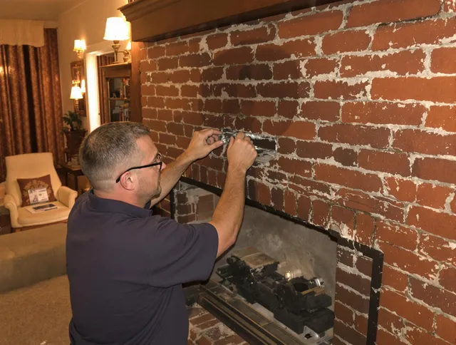 Hull Chimney Sweep expert fixing a fireplace in Hull, MA